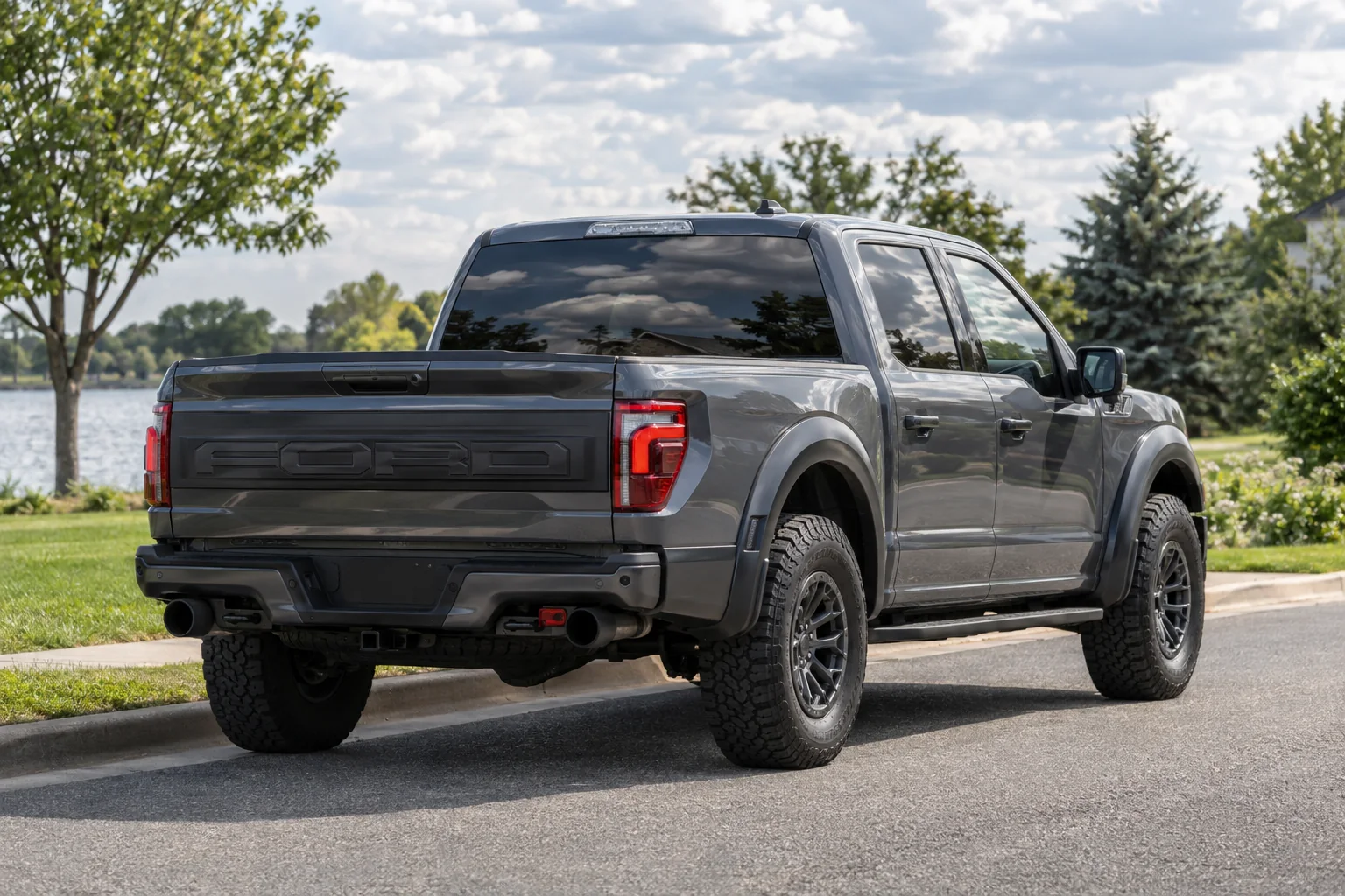 Graphite gray Ford F-150 Raptor with tinted windows at OnPoint Tintz