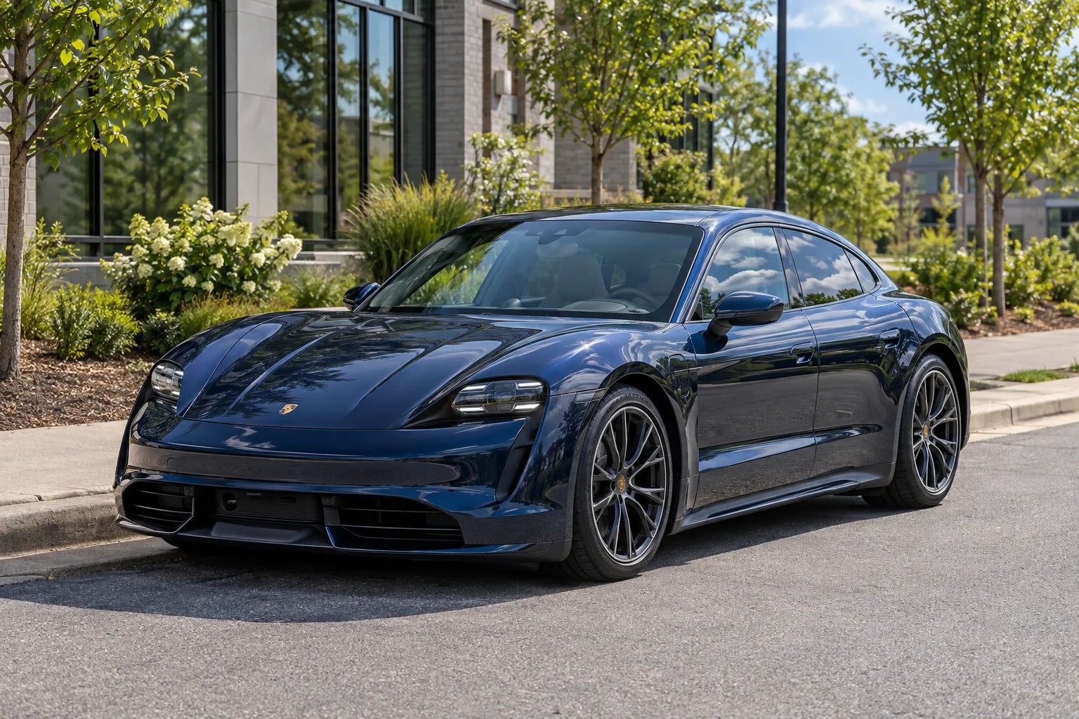 A Porsche Taycan with Union Ceramic IR tint in the sun