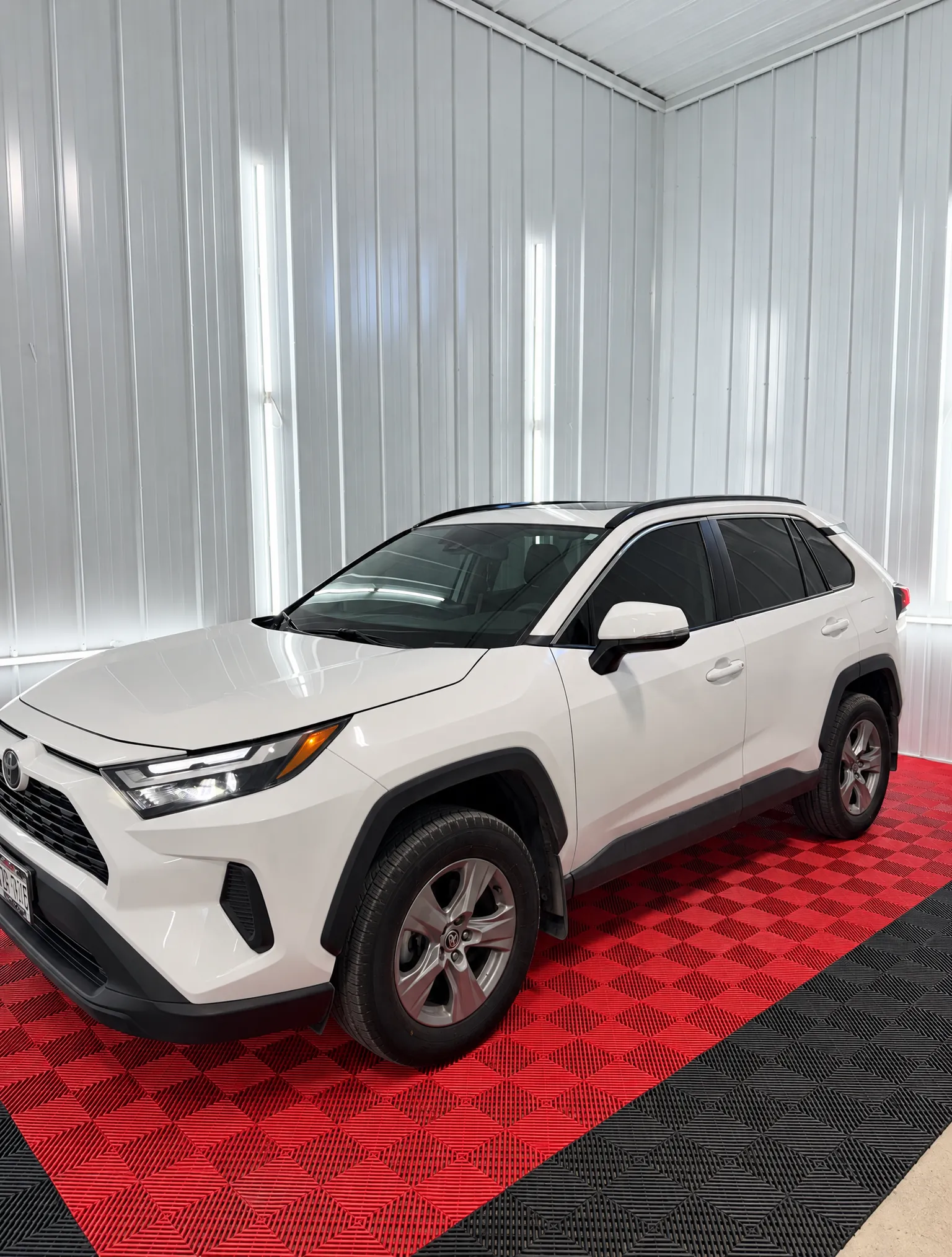 White Toyota RAV4 with tinted windows in the OnPoint Tintz bay
