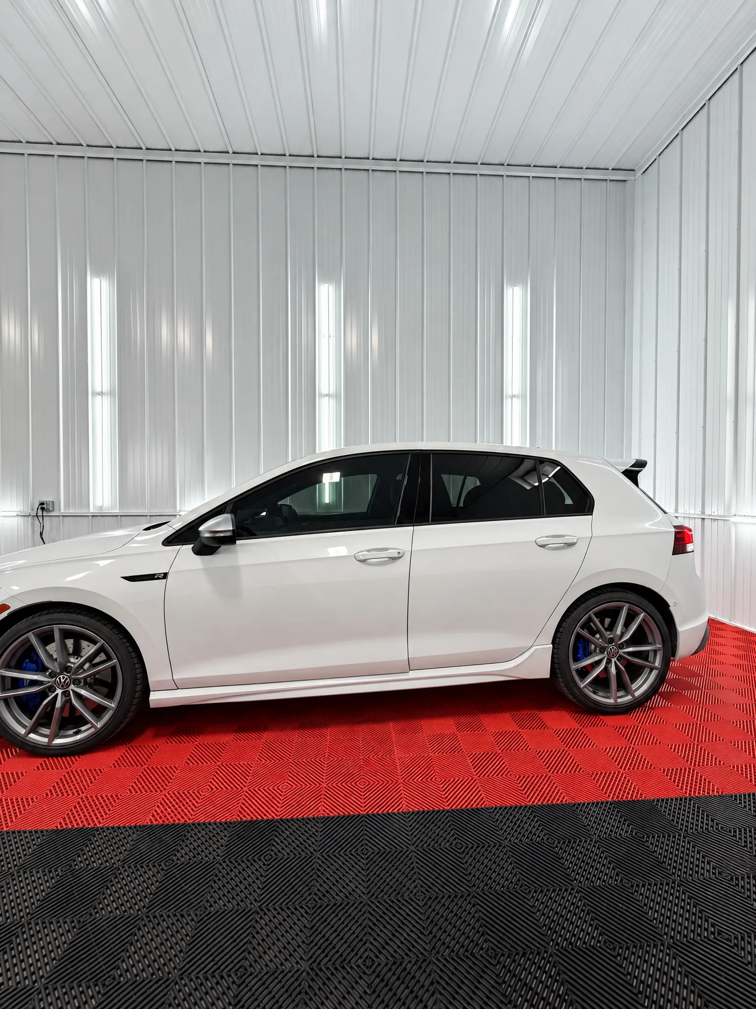 White Volkswagen Golf with tinted windows in the OnPoint Tintz bay
