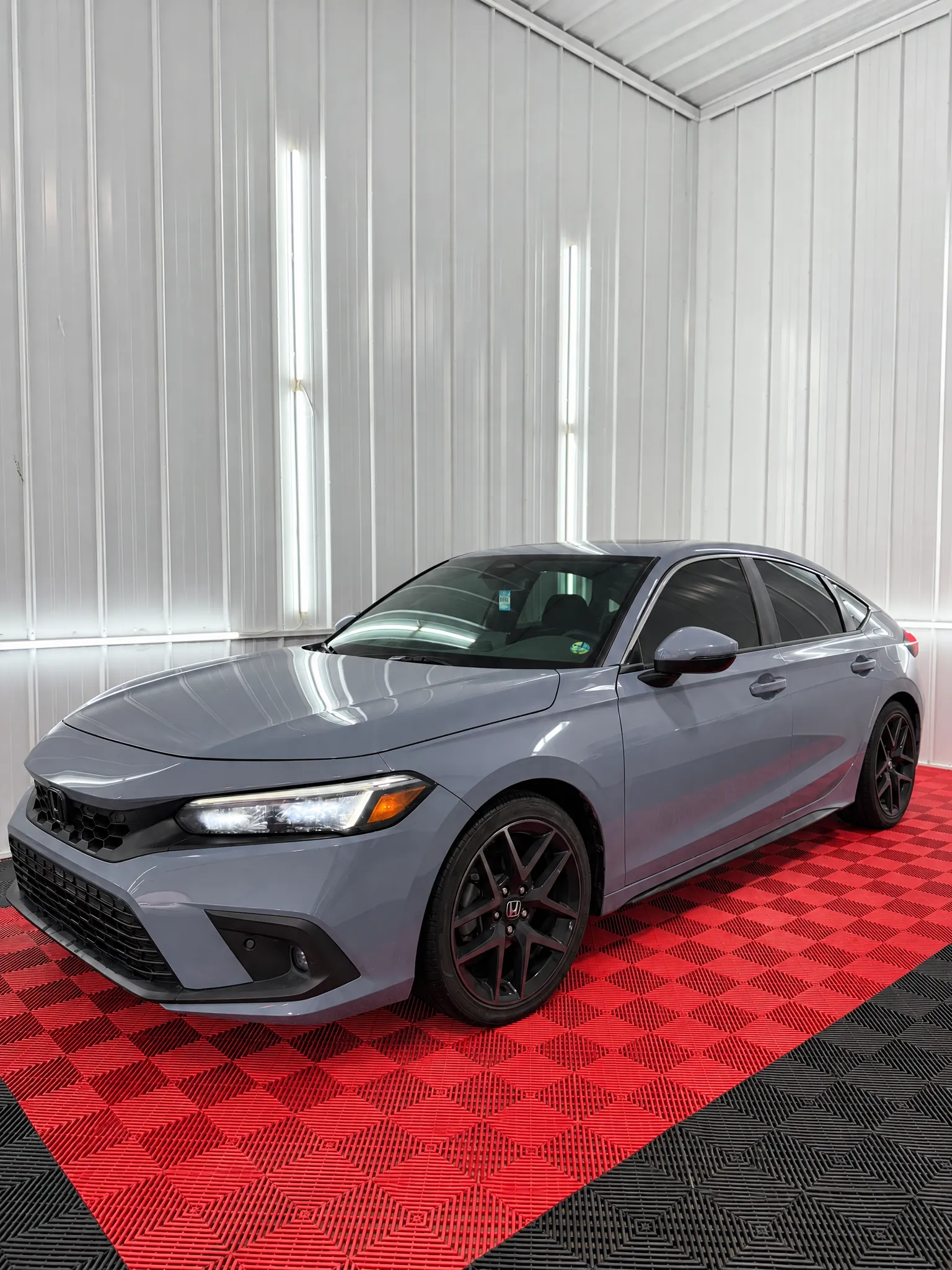 Gray Honda Civic with tinted windows in the OnPoint Tintz bay