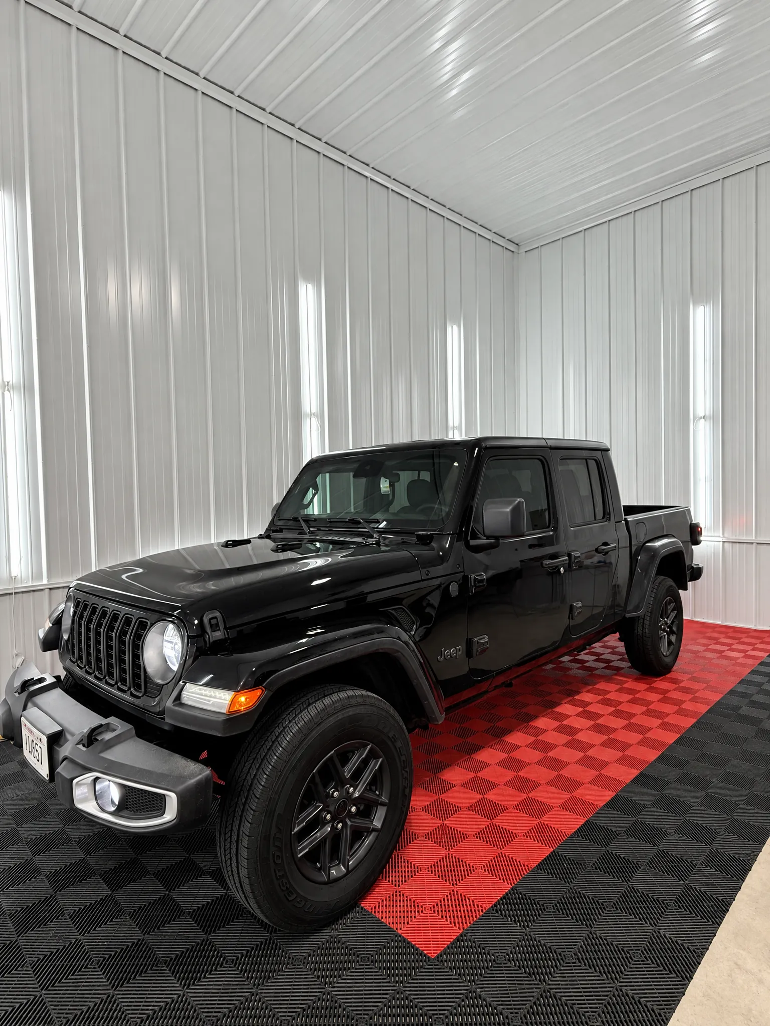 Black Jeep Gladiator with tinted windows in the OnPoint Tintz bay