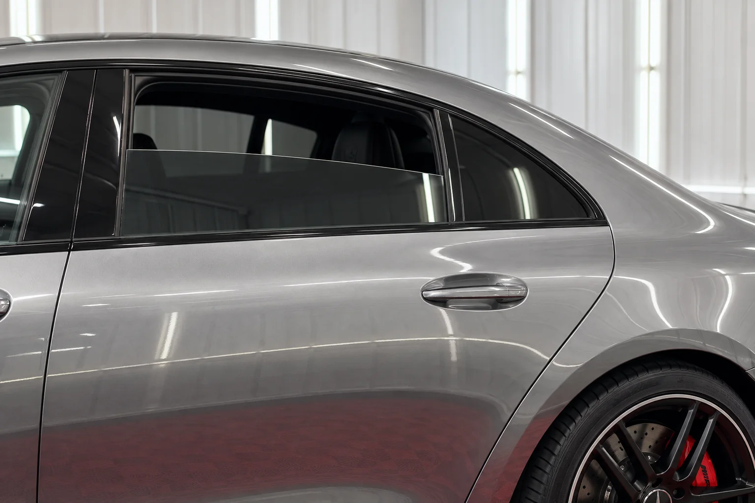 Liquid silver Mercedes-AMG GT with tinted windows at OnPoint Tintz