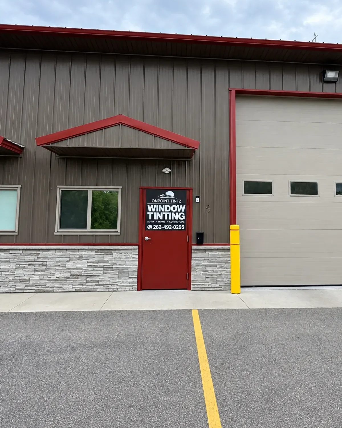 The OnPoint Tintz shop on Gravity Court in Waterford: red trim and a red door with their sign